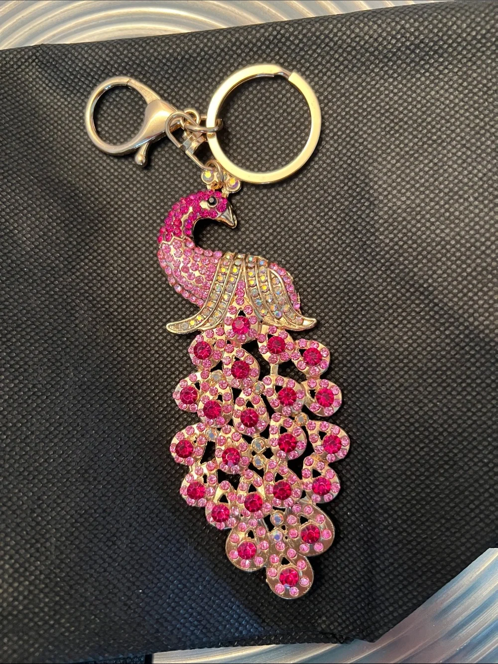 PEACOCK KEYCHAIN- Pink, Red and Iridescent stones set in Gold tone.